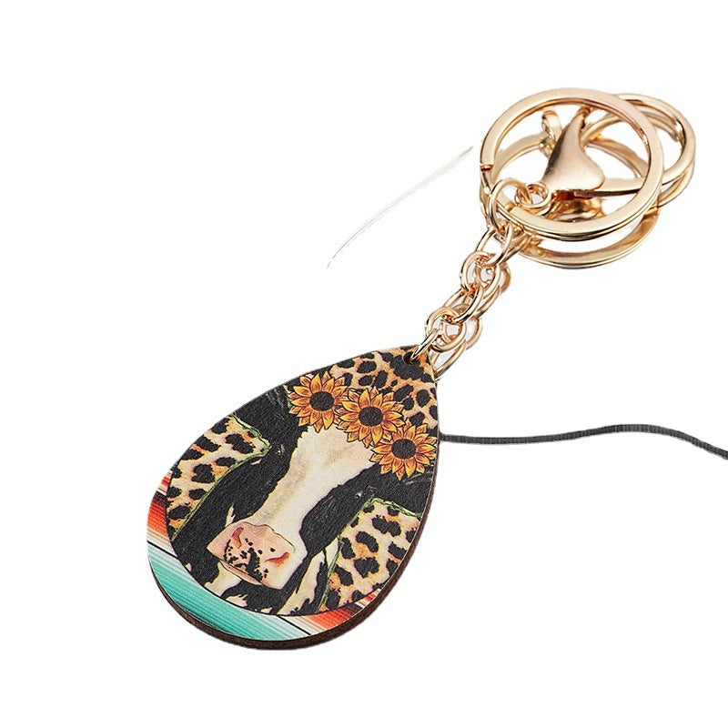 Llavero de metal de flores de vaca de leopardo occidental al por mayor